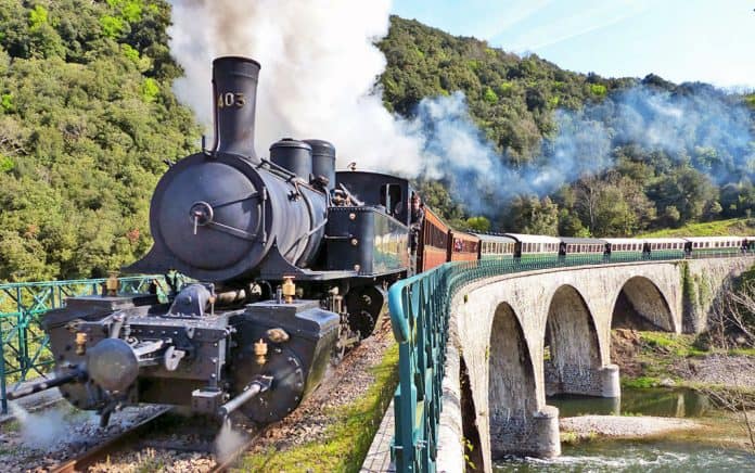 The Train de l'Ardeche steams through the gorges of Ardeche in Southeastern France's Auvergne-Rhône-Alpes region.