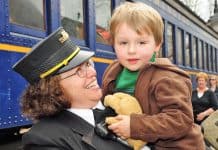 Train conductor and child at the Wilmington & Western Railroad