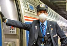 Masked Amtrak conductor
