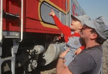 Dad and son by historic train
