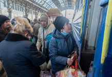 Ukrainian evacuees board train