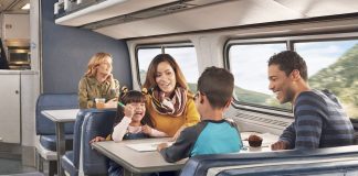 Family traveling together aboard an Amtrak train.