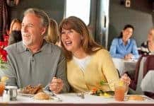Boomer couple enjoys the view from an Amtrak dining car.