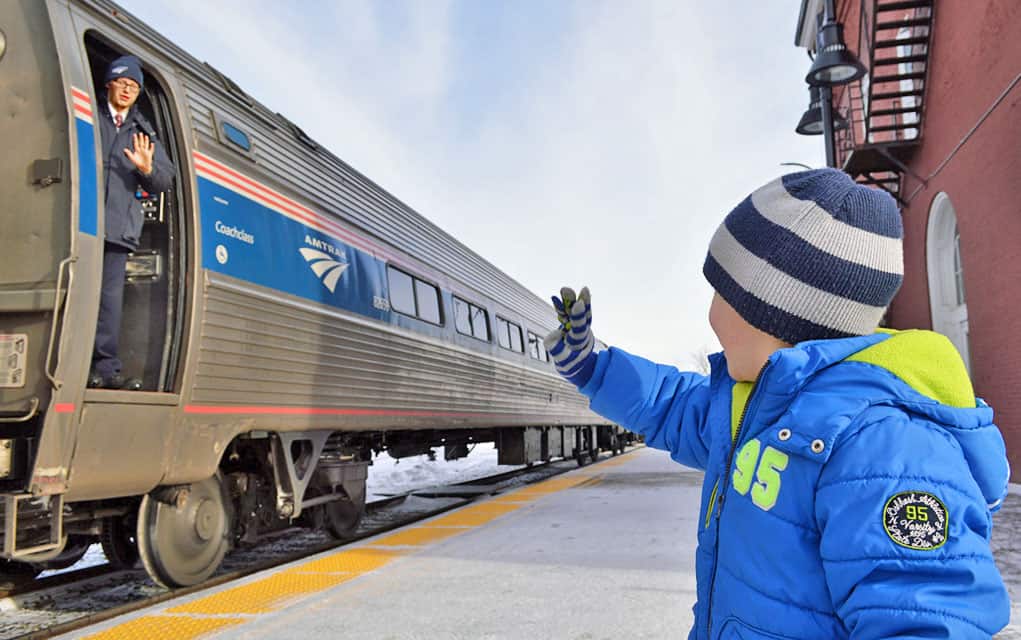 Boy waving at conductor on Amtrak Vermonter