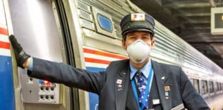 Amtrak conductor wearing mask